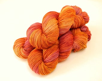 Hand Dyed Yarn. DK Weight Superwash Merino Wool. Potluck Orange & Raspberry. Indie Dyed Yarn. Tonal Citrus Shades. Crochet Knitting Supply
