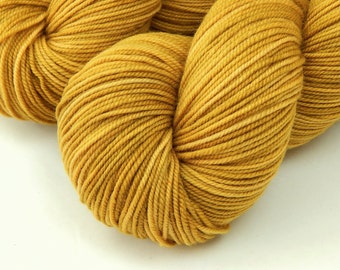 Hand Dyed Yarn. Sport Weight Superwash Merino Wool. HONEY MUSTARD. Indie Dyer Variegated Gold Knitting Yarn. Tonal Yellow Heavier Sock Yarn