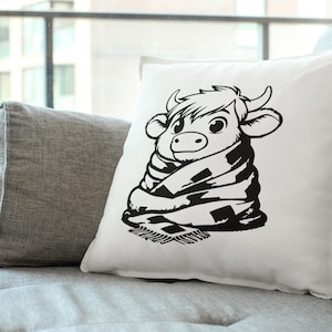 Puede incluir: Ilustraci&oacute;n en blanco y negro de una vaca envuelta en una manta. La vaca mira hacia la derecha y tiene una expresi&oacute;n amigable. La manta tiene un patr&oacute;n a cuadros.
