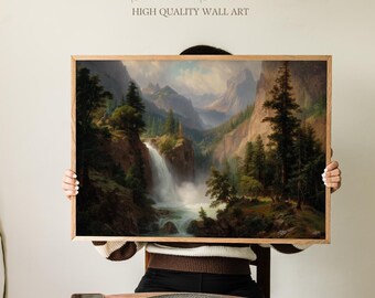 May include: A framed landscape painting featuring a waterfall cascading down a rocky cliff, surrounded by lush green trees and towering mountains. The artwork is in a wooden frame. The text "Sundried Season HIGH QUALITY WALL ART" is at the top.