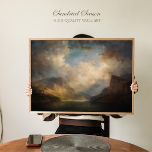 May include: A framed landscape art print with a dramatic sky and mountain range. The artwork features a color palette of blues, browns, and golds. The text "Sundried Season HIGH QUALITY WALL ART" is displayed at the top.