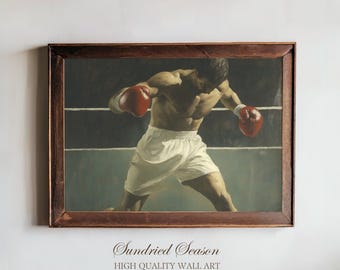 Puede incluir: Pintura vintage enmarcada de un boxeador en un ring de boxeo. El boxeador lleva pantalones cortos blancos y guantes rojos, con una constitución muscular. La pintura está en un marco de madera marrón oscuro. El texto "Sundried Season HIGH QUALITY WALL ART" está en la parte inferior.