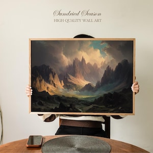 Könnte beinhalten: Ein gerahmter Kunstdruck mit einer Berglandschaft unter einem bewölkten Himmel. Das Kunstwerk hat eine Vintage-Ästhetik mit warmen und kühlen Farbtönen. Der Text "Sundried Season" und "HIGH QUALITY WALL ART" ist oben zu sehen.