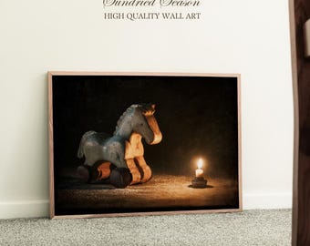 May include: Wooden framed wall art print featuring a vintage rocking horse in blue and tan. A lit candle sits to the right of the horse. The text "Sundried Season HIGH QUALITY WALL ART" is at the top of the image.