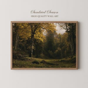May include: A rectangular wall art print in a wooden frame featuring a landscape painting of a forest with golden yellow autumn leaves, dark green pine trees, and a mossy ground. The text Sundried Season HIGH QUALITY WALL ART is above the frame.