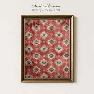 May include: Framed wall art featuring a repeating floral design in red, brown, and cream hues. The artwork is presented in a gold-coloured frame. The text "Sundried Season HIGH QUALITY WALL ART" is at the top.