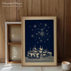Lámina artística retro de un pueblo invernal de los años 50, lámina navideña de mediados de siglo en marfil y azul marino, arte navideño escandinavo vintage para el salón de tu casa nórdica. imagen 1