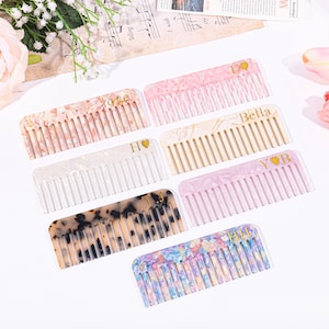 May include: Set of eight colourful combs with personalised names and hearts. The combs are made of a translucent plastic material with a variety of patterns and colours, including pink, white, beige, brown, and blue.
