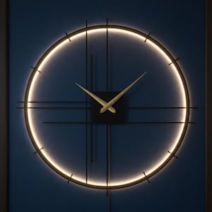 May include: A modern, round wall clock with a black frame and gold-colored hands. The clock features a glowing, circular light and a dark blue background. The clock's diameter is approximately 30 inches.