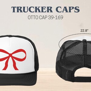 May include: A black and white trucker cap with a red bow on the front. The cap is 3.5 inches tall and 3.03 inches wide. The cap is 22.8 inches in circumference. OTTO CAP 39-169.