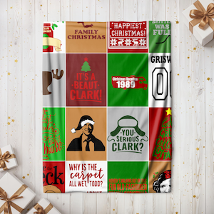 May include: A Christmas Vacation themed fleece blanket with a red, green, and white color scheme. The blanket features various quotes and images from the movie, including "It's a beaut Clark!" and "You serious Clark?"