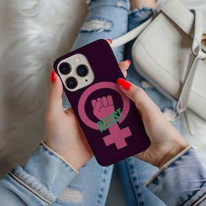 May include: A purple phone case with a pink feminist symbol and the word "RESIST" in green letters.