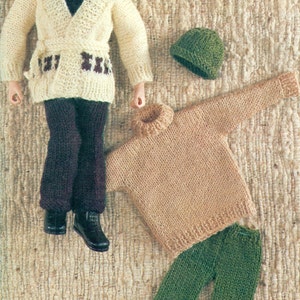 May include: A set of knitted doll clothes including a white cardigan with brown trim, a brown turtleneck sweater, green pants, and two hats.