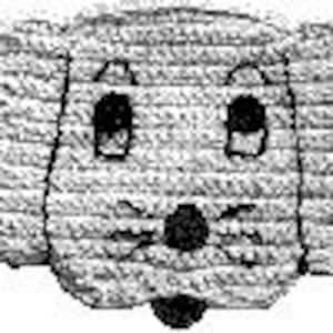 May include: A crocheted dog toy with a gray and white color scheme. The toy has a black nose and eyes.