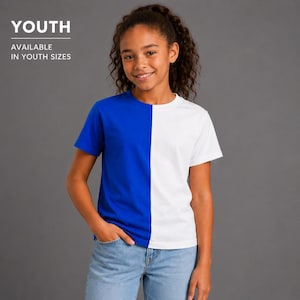 May include: A short-sleeve crew neck t-shirt featuring a split design with a solid royal blue color on the left side and a solid white color on the right side. The text YOUTH AVAILABLE IN YOUTH SIZES is printed in white in the upper left corner.