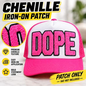 May include: A bright pink chenille iron-on patch featuring the word DOPE in bold, textured letters with black outlines. The patch is displayed on a white and pink trucker hat, though the hat is not included with the purchase of the patch.