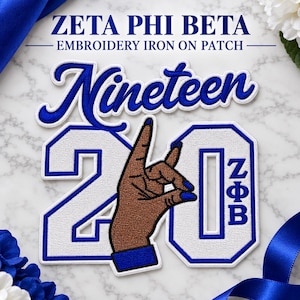 May include: A Zeta Phi Beta embroidery iron-on patch featuring the word Nineteen in blue script above the number 20 in white with blue borders. A brown hand making a hand sign is centered, and the Greek letters ZΦB are vertically aligned.