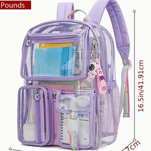 May include: A clear and purple backpack with multiple compartments, including a front pocket and side mesh pocket. The backpack is 16.5 inches tall, 12 inches wide, and 5 inches deep. It features a rainbow strap and a keychain with an astronaut charm. The text "SIZE INFORMATION" is at the top.