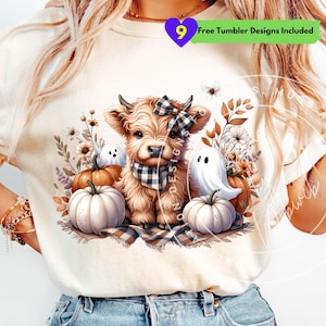 May include: Cream-colored t-shirt featuring a Highland cow illustration with a plaid bow and scarf, surrounded by pumpkins, ghosts, and floral accents. The design includes the text "Free Tumbler Designs Included".
