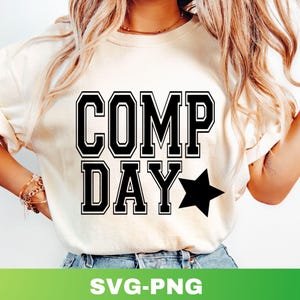 May include: Cream-colored t-shirt with the words "COMP DAY" in bold, black, collegiate-style lettering. A black star is to the right of "DAY". The bottom of the image has the text "SVG-PNG" in white on a green background.