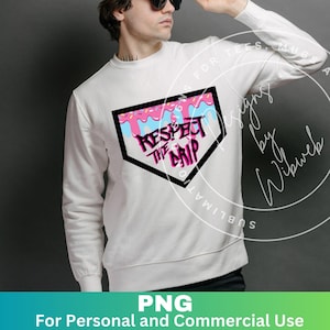 May include: White sweatshirt with a black baseball diamond graphic. The graphic has pink and blue dripping icing with sprinkles and the text "Respect the Drip".