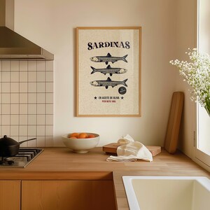 Vintage-style sardine poster with hand-drawn fish illustration, retro Spanish label typography, in aged cream, teal and rust tones.