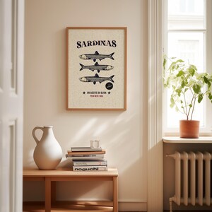 Vintage-style sardine poster with hand-drawn fish illustration, retro Spanish label typography, in aged cream, teal and rust tones.