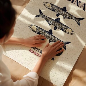 Vintage-style sardine poster with hand-drawn fish illustration, retro Spanish label typography, in aged cream, teal and rust tones.