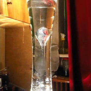 Lava lamps are available to order and ready-made, in any shape, size, and color. The base is made of granite, and the top is glass.