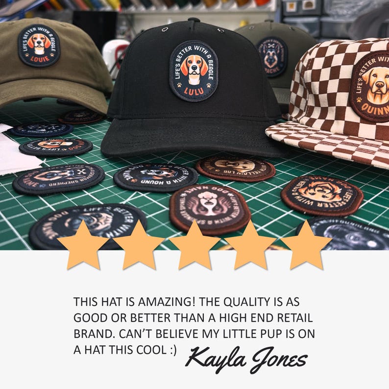 May include: A black baseball cap with a patch that reads "Life's Better With A Beagle" and the name "Lulu". The cap is surrounded by several patches featuring dogs and the text "Life's Better With A Beagle".