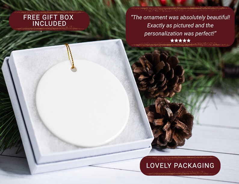May include: A white ceramic ornament with a gold string, presented in a white gift box. The ornament is round and blank, ready for personalization. The packaging is described as "Lovely".