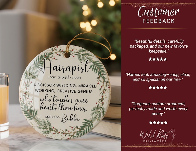 May include: A round, white ceramic ornament with the word "Hairapist" in elegant script, surrounded by a green and red floral wreath. The ornament includes text defining "Hairapist" and a gold string for hanging.