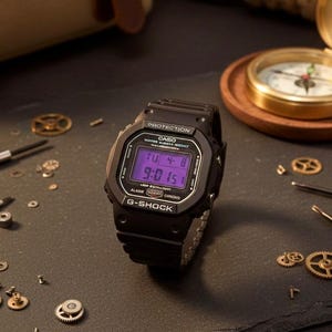 May include: A black G-Shock digital watch with a purple display showing the date and time. The watch is surrounded by watchmaking tools and small gears on a dark surface. A compass is in the background.