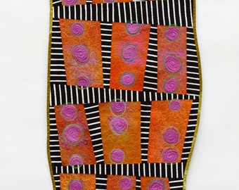 Orange art quilt, black and white striped wall hanging, orange and purple hand dyed fabric quilt