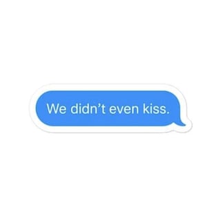 May include: A blue text bubble sticker with the text "We didn't even kiss." The sticker has a white border and a speech bubble tail on the right side. The background is plain white.