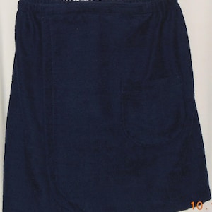 May include: A dark blue wrap skirt made of terry cloth with a single pocket on the right side.