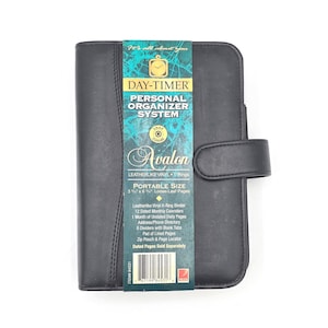 May include: Black Day-Timer personal organizer system. The cover has a snap closure and a tab closure. The label reads "Day-Timer Personal Organizer System Avalon". The portable size is 3.75 x 6.25 inches.