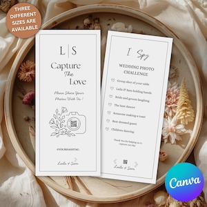 May include: Two white wedding cards with black text. One card says "Capture The Love" with a camera graphic. The other card says "I Spy WEDDING PHOTO CHALLENGE" with a list of photo prompts. The cards are on a decorative tray.