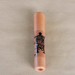 Chillum with prehistoric drawing