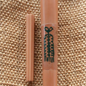 Chillum with prehistoric drawing