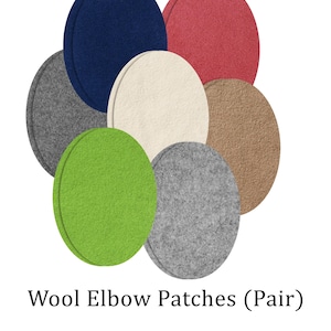 Puede incluir: Un conjunto de parches de codo ovalados de lana en varios colores, incluyendo azul marino, rojo, gris, crema, verde y marrón. Los parches están dispuestos en un patrón circular. El texto dice "Wool Elbow Patches (Pair)" y "More colors & sizes available".