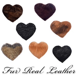 May include: Seven heart-shaped patches made of fur and leather. The patches are in various colors, including brown, black, and tan. The text "Fur Real Leather" is printed below the patches.
