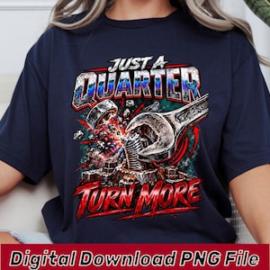 May include: A navy blue t-shirt featuring a graphic print of a metal wrench tightening a bolt. The text reads JUST A QUARTER at the top and TURN MORE at the bottom in bold red and white lettering, surrounded by sparks and mechanical debris.