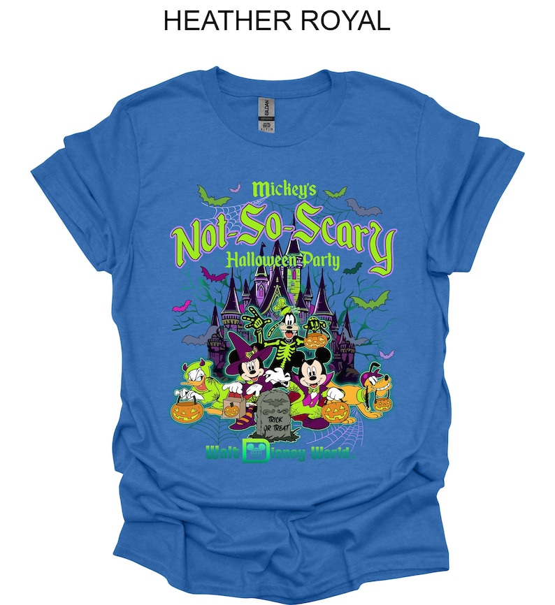 May include: Heather royal blue t-shirt featuring a Halloween graphic. The graphic includes the text "Mickey's Not-So-Scary Halloween Party" with images of Disney characters and a haunted castle. The shirt is a crew neck.