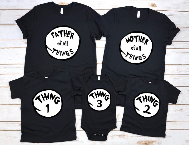 May include: Black family matching t-shirts and a onesie. The shirts have white circles with the phrases "FATHER of all THINGS", "MOTHER of all THINGS", "THING 1", "THING 2", and "THING 3". The onesie has snaps at the bottom.
