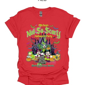 May include: Red t-shirt featuring a Halloween design with Mickey Mouse, Donald Duck, Goofy, and Pluto. The graphic includes a haunted castle, bats, and the text "Mickey's Not-So-Scary Halloween Party" and "Walt Disney World."