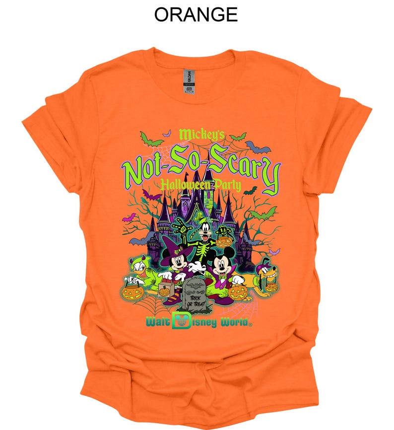 May include: Orange t-shirt featuring a graphic for Mickey's Not-So-Scary Halloween Party at Walt Disney World. The design includes Mickey Mouse, Minnie Mouse, Donald Duck, Goofy, Pluto, and a spooky castle.