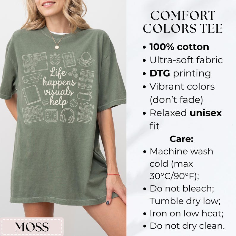May include: A moss green t-shirt with the text "Life happens visuals help" and various white graphic icons. The shirt is made of 100% cotton and has a relaxed unisex fit.
