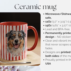 May include: Ceramic mug with a red interior and handle, featuring a watercolor portrait of a dog named Charlie. The mug has red and white vertical stripes and is 11oz (3.7" x 3.19") or 15oz (4.61" x 3.27").