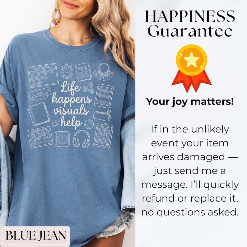 May include: A blue jean-colored t-shirt with the phrase "Life happens visuals help" and various visual aid icons printed in white. The shirt also features the text "BLUE JEAN".